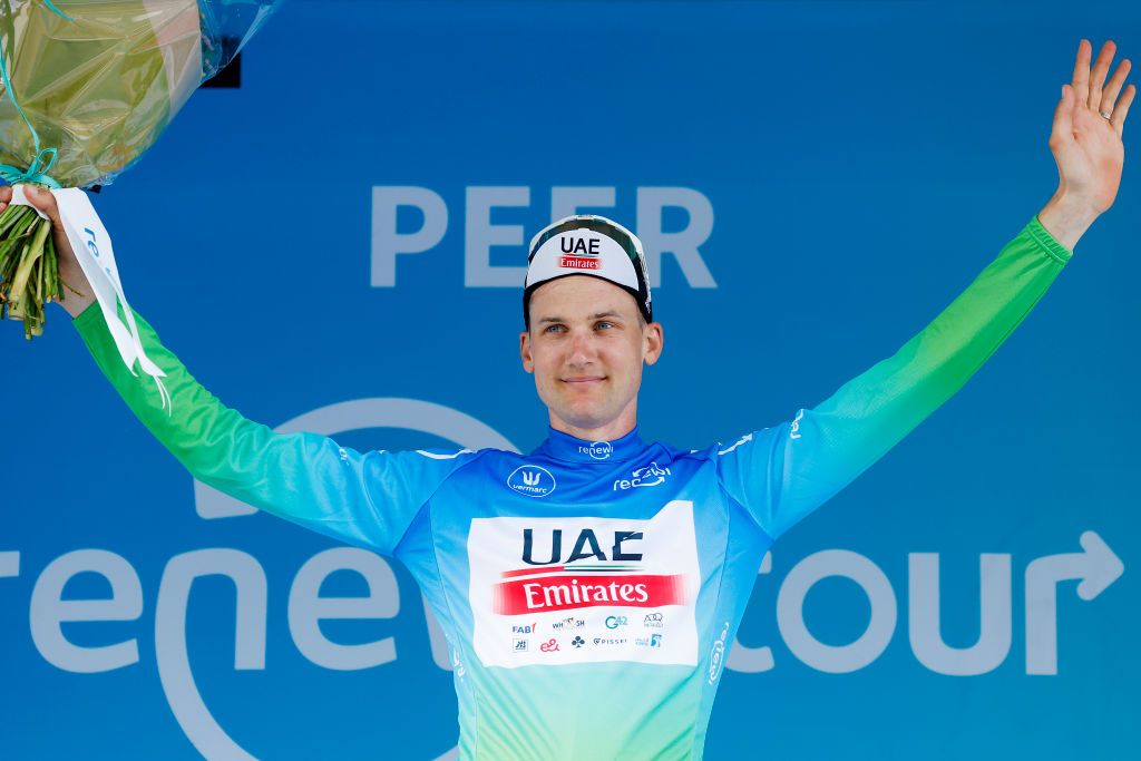 PEER BELGIUM AUGUST 26 Tim Wellens of Belgium and UAE Team Emirates celebrates at podium as Blue Leader Jersey winner during the 19th Renewi Tour 2023 Stage 4 a 1794km stage from Beringen to Peer UCIWT on August 26 2023 in Peer Belgium Photo by Bas CzerwinskiGetty Images
