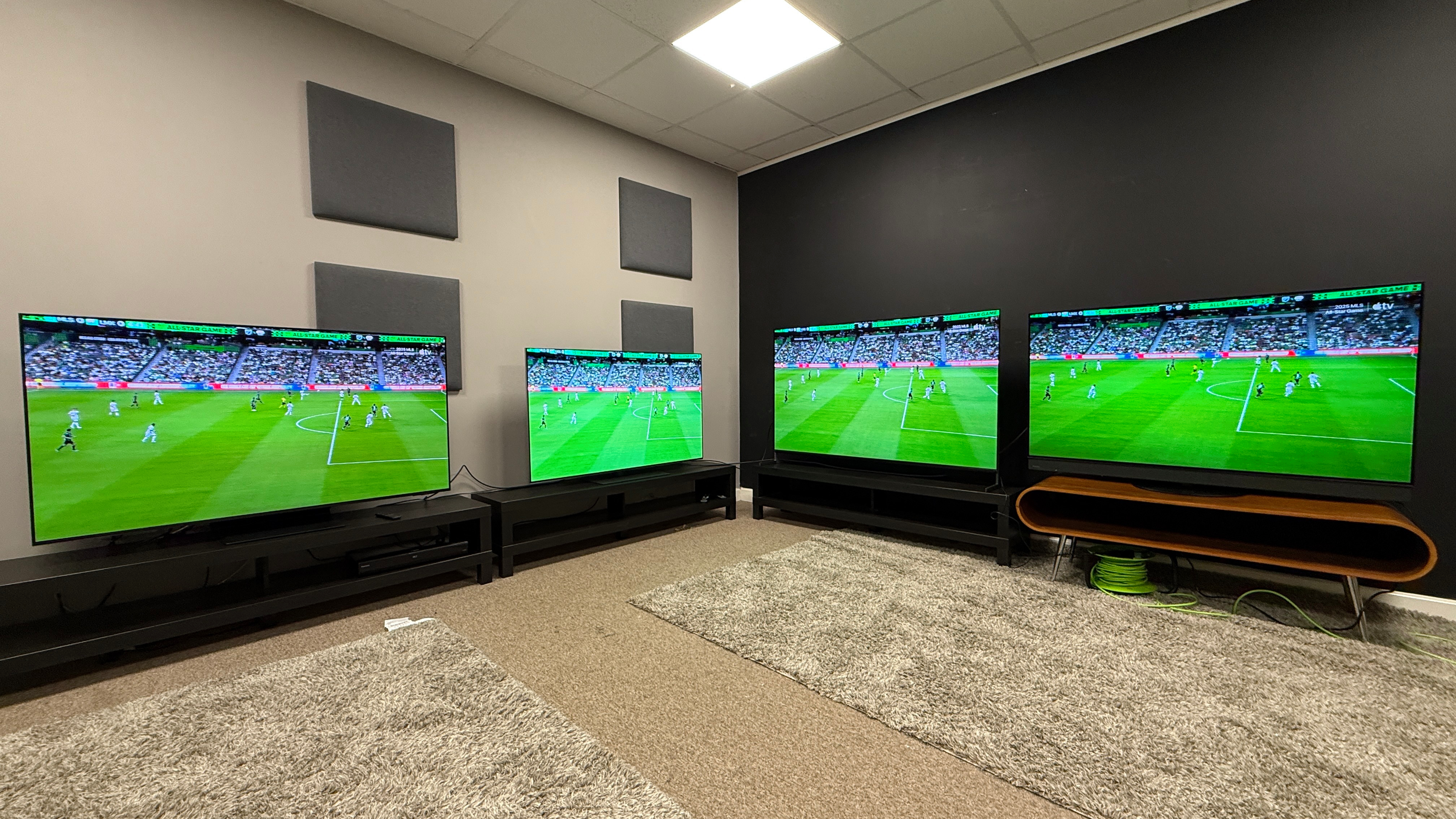 Samsung S95F (far left) LG G5 (middle left) Sony Bravia 8 II (middle right) Panasonic Z95B (far right) OLED TV showing MLS All-Star soccer game on screen