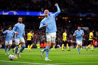 Erling Haaland of Manchester City celebrates after scoring the team's first goal from the penalty spot during the UEFA Champions League match between Manchester City and BSC Young Boys at Etihad Stadium on November 07, 2023 in Manchester, England.