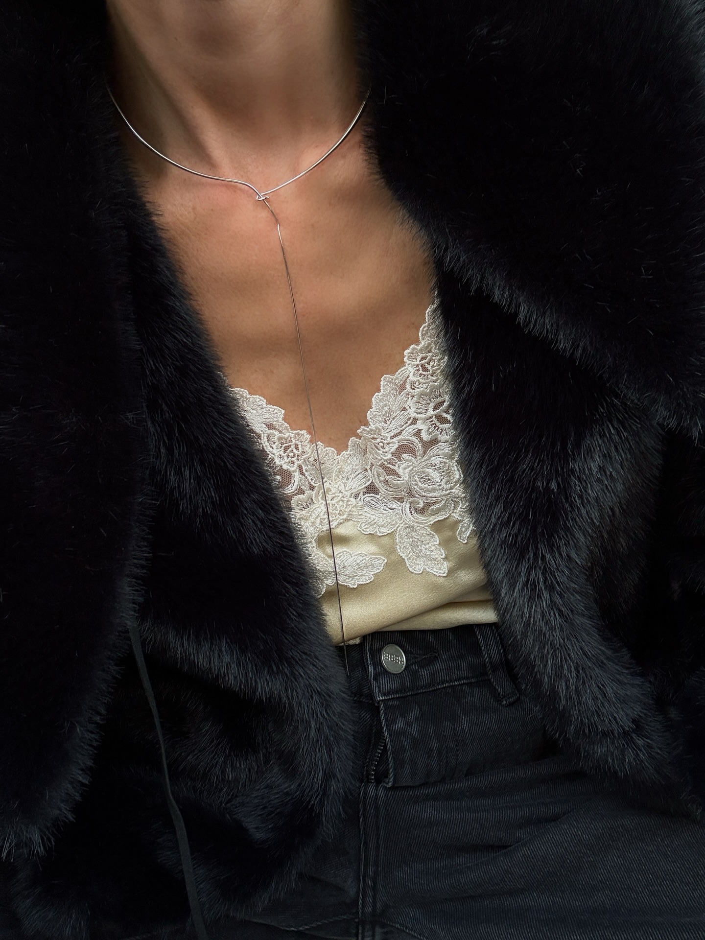 Girl posing for a picture wearing neutral, classic pieces