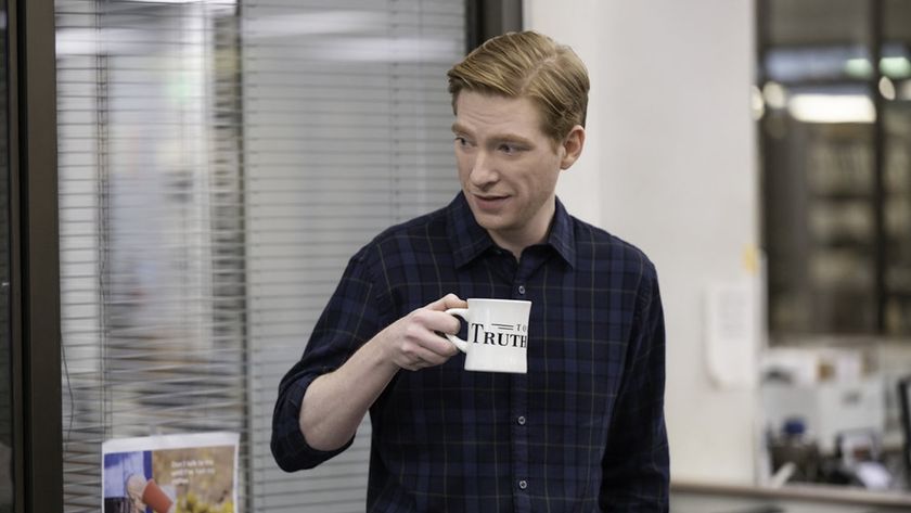 Domhnall Gleeson with a mug in The Paper