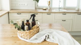 Natural cleaning products displayed on a kitchen table