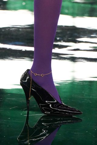 detail image of a horsebit accessory on the Gucci fall/winter 2025 runway