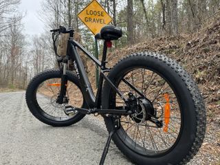 The Hiboy P6 Fat Tire Bike on gravel tracks.