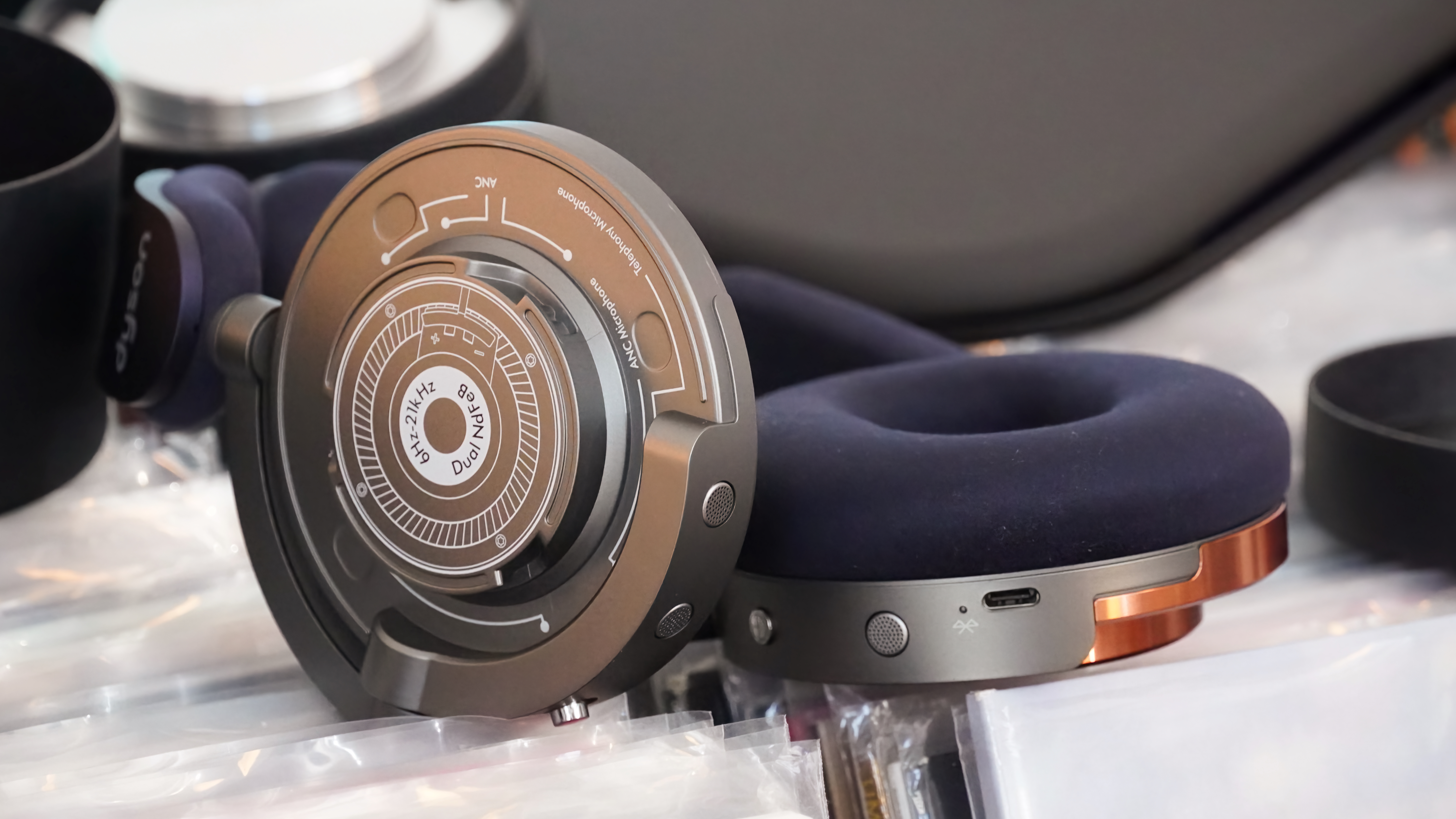 The Dyson OnTrac headphones with a mix of silver and copper caps.