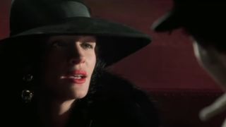 Julia Roberts wears a big hat in Confessions of a Dangerous Mind