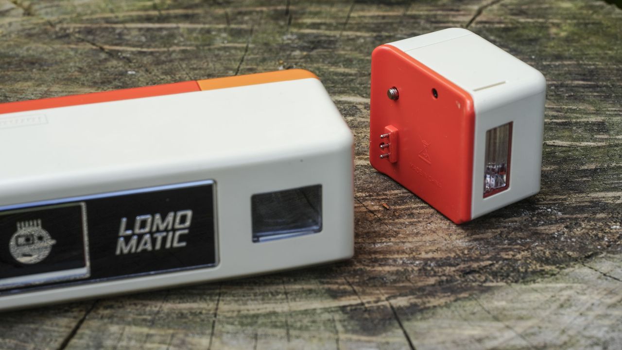 A close up image showing the controls of the Lomography Lomomatic 110 film camera