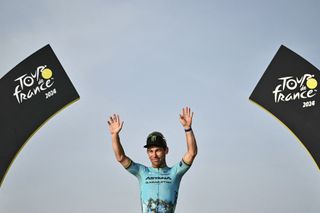 Mark Cavendish on the podium of the Tour de France 2024.