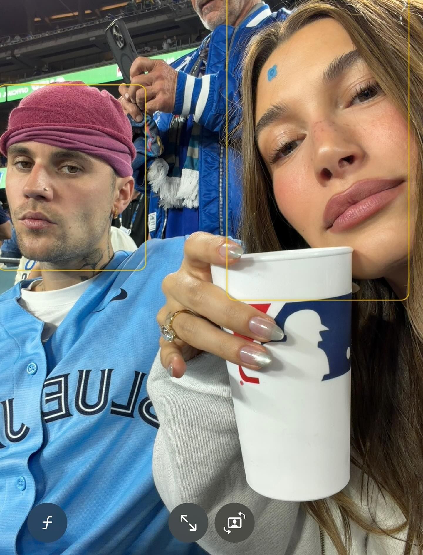 An image of Justin and Hailey Bieber spotlighting Hailey's chrome velvet nails.