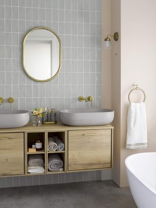 bathroom with wooden wall hung cabinet