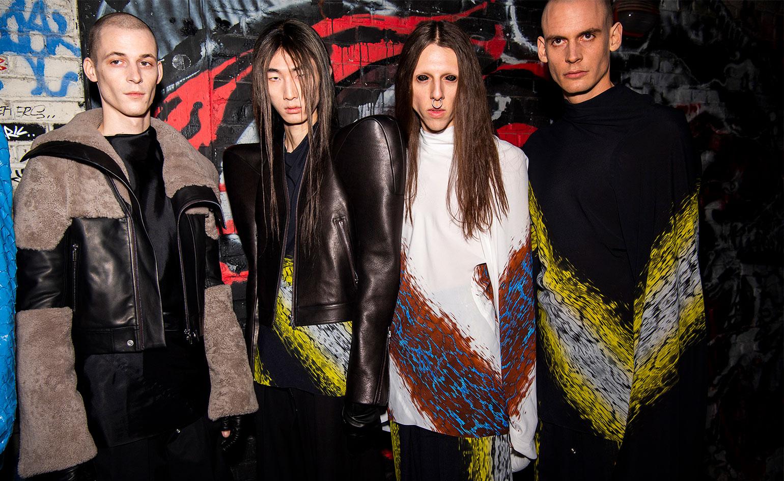 four male models with dark clothing