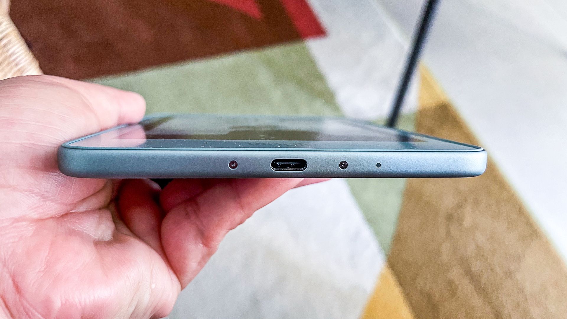 The USB-C port and screws on either side on the bottom edge of the Amazon Kindle 2026