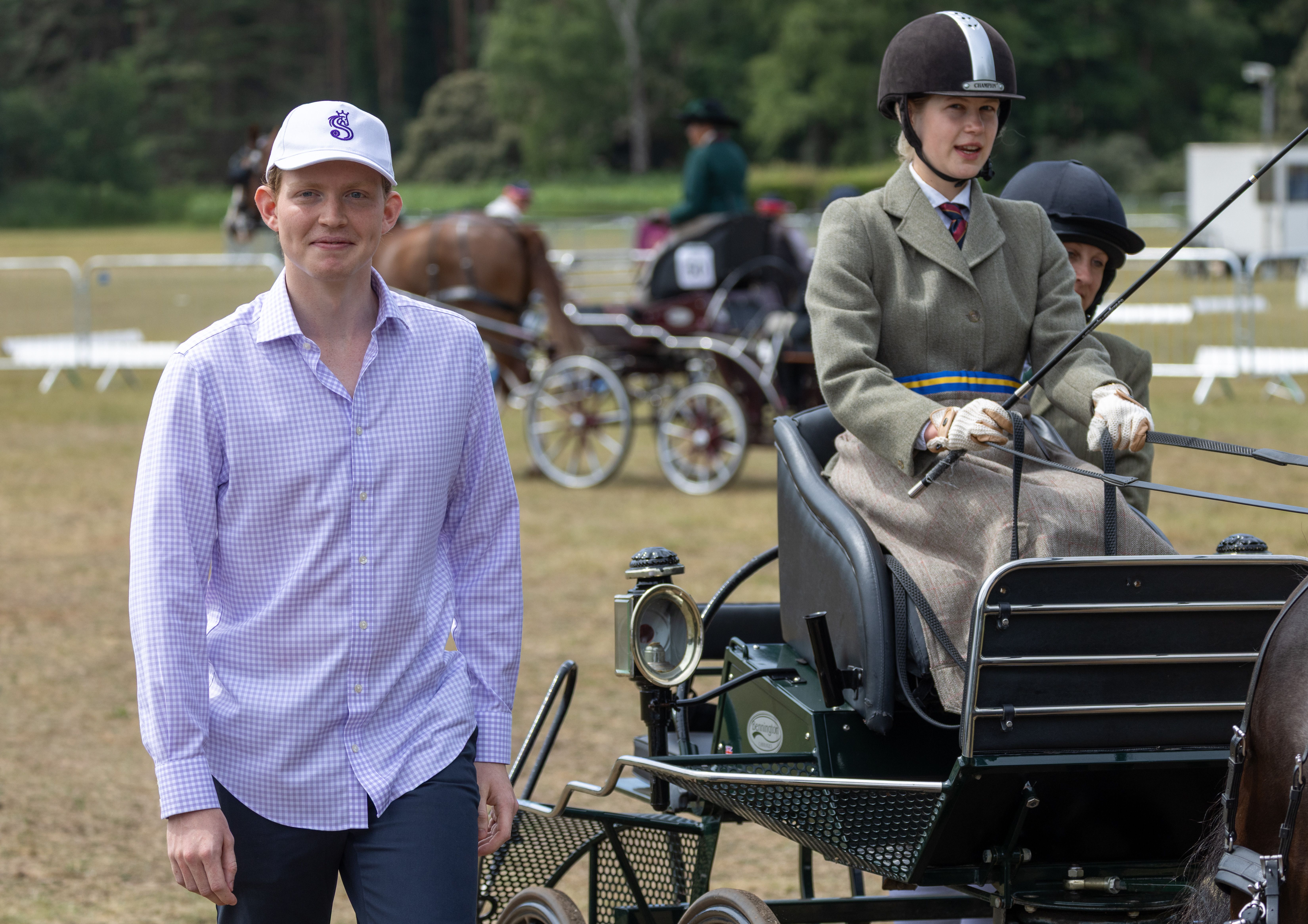 Lady Louise in a carriage next to Felix da Silva-Clamp at a horse driving competition