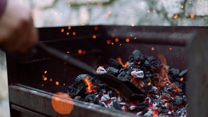 Close-up of charcoal burning in barbecue grill 