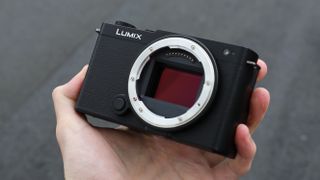 Panasonic Lumix S9 camera held in a hand