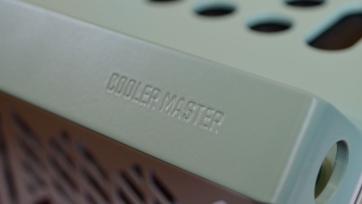 A Cooler Master Qube 500 PC case on a desk