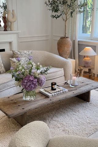 white living room with sofa and coffee table