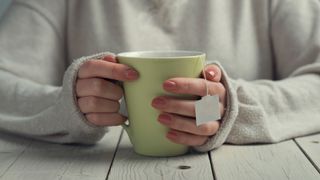 woman holding a mug of tea