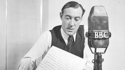 Roger Dougall pictured with his BBC microphone in 1951