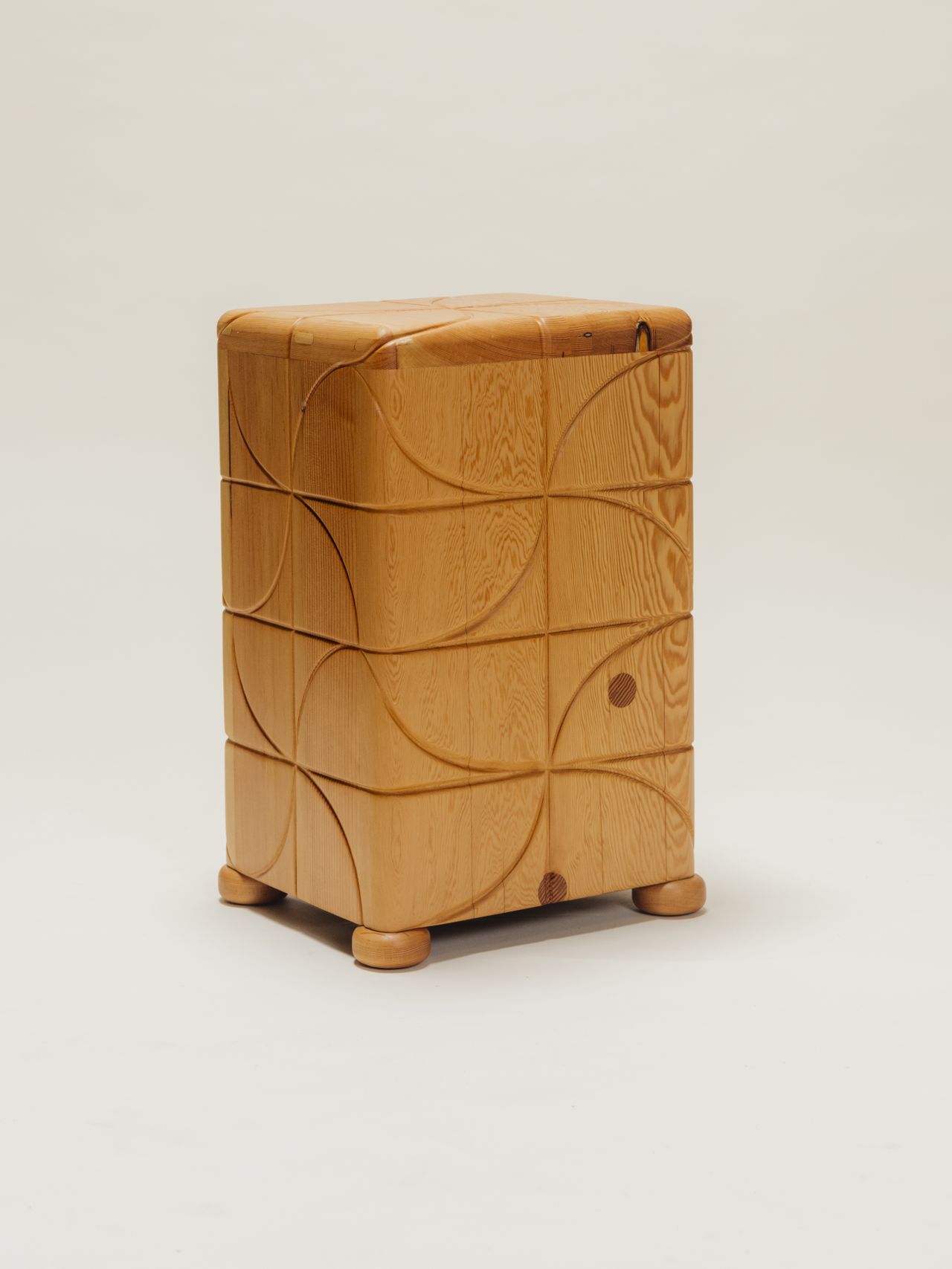 Chunky-looking furniture items including armchairs, chairs, stools, coffee tables, and sofas boast an organic feel and pleasing surface against a cream background.