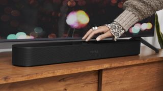 Hero image for the best Dolby Atmos soundbars showing Sonos Beam