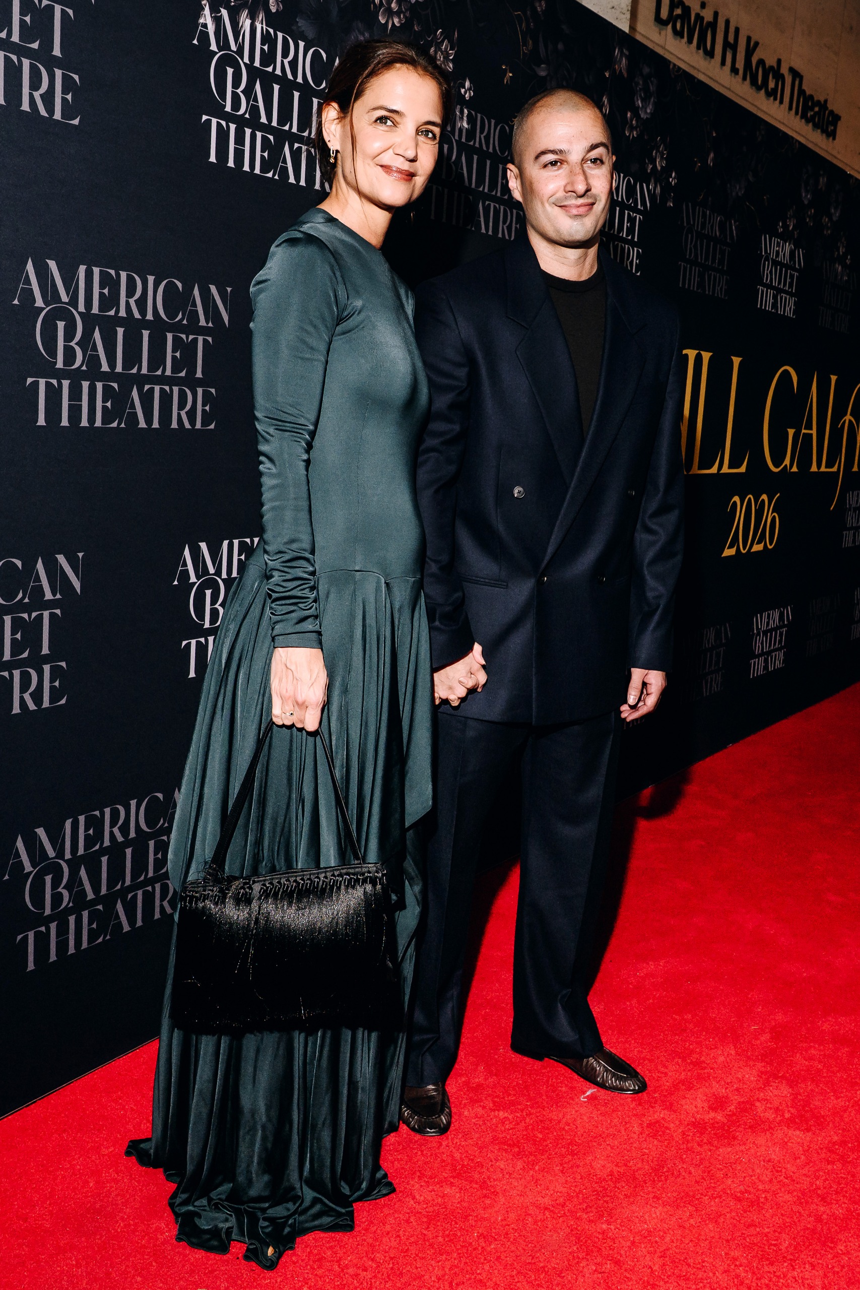 Katie Holmes arrived at the American Ballet Theatre Fall Gala in a long-sleeve satin dress and a fringe tassel-covered black evening bag