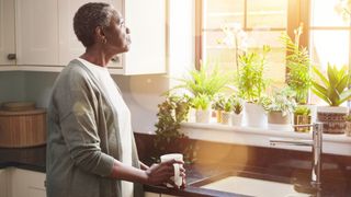 A woman savouring her first coffee of the day