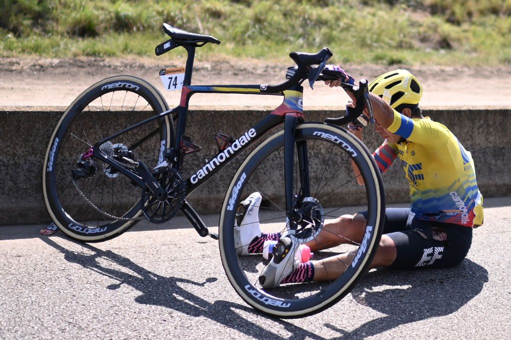 Team Education First rider Colombias Sergio Higuita sits on the road after crashing during the 15th stage of the 107th edition of the Tour de France cycling race 175 km between Lyon and Grand Colombier on September 13 2020 Photo by Marco BERTORELLO AFP Photo by MARCO BERTORELLOAFP via Getty Images