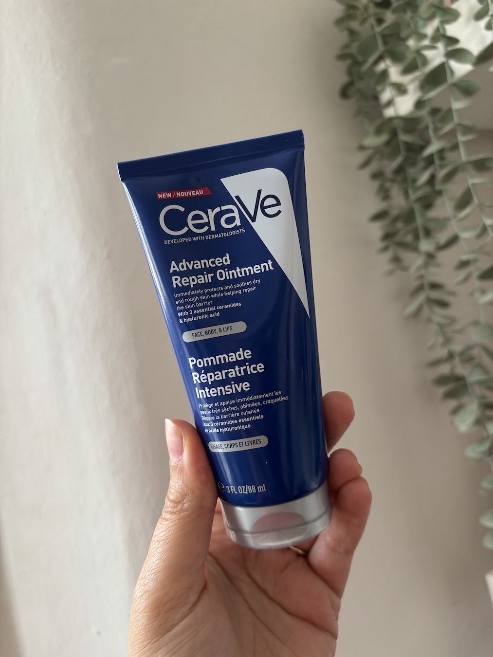 Mica Ricketts holding CeraVe Advanced Repair Ointment