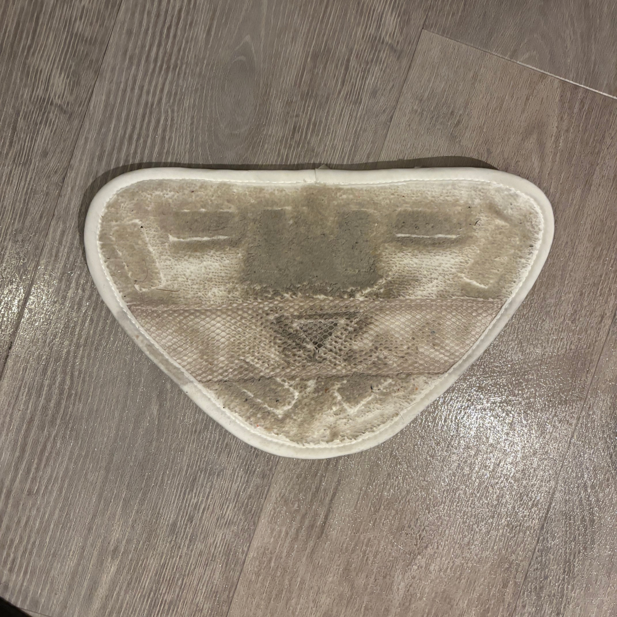 dirty mop pad placed on floor