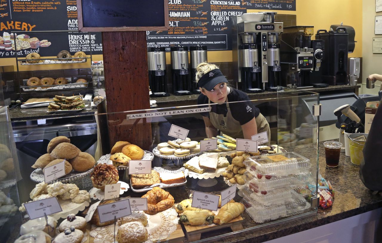 An employee works at a bakery in Massachusetts.