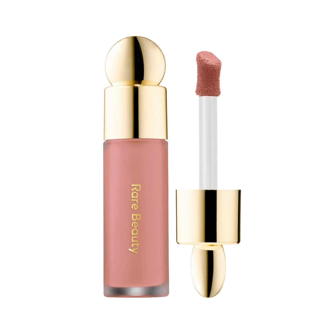 A product shot of the Rare Beauty Soft Pinch Liquid Blush in Hope, (a soft, rose/mauve shade), on a white background