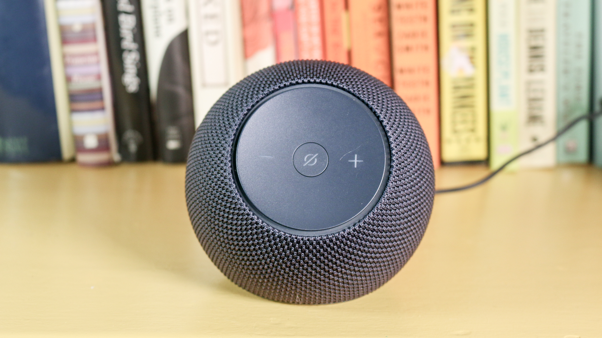 Echo Dot Max on a book shelf