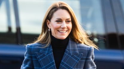 Catherine, Princess of Wales smiles as she arrives for a visit to the National Curling Academy