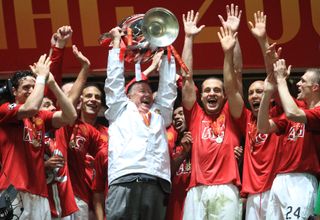 Sir Alex Ferguson lifts the Champions League trophy alongside his Manchester United players after victory over Chelsea on penalties in Moscow in May 2008.