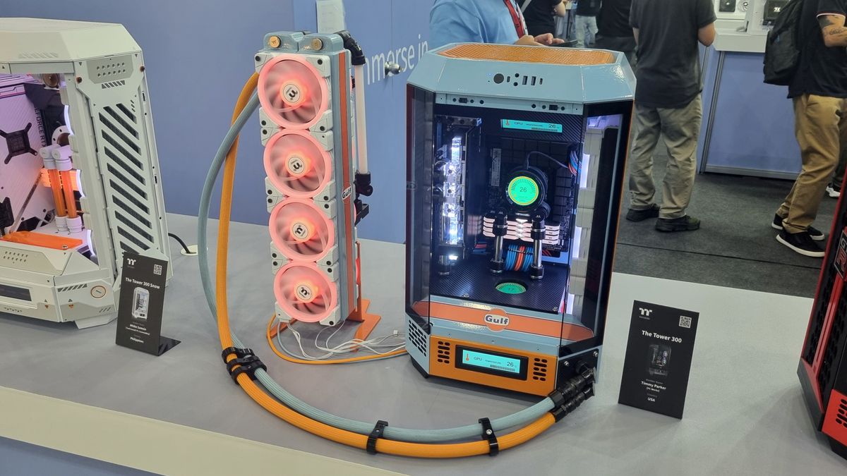 A Thermaltake custom case at Computex 2024, with a huge watercooling radiator outside linked to the case itself by long tubing