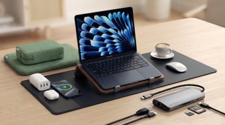 MacBook on desk with accessories