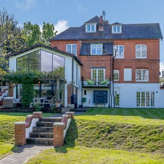 huge home with traditional touch with greeny front yard