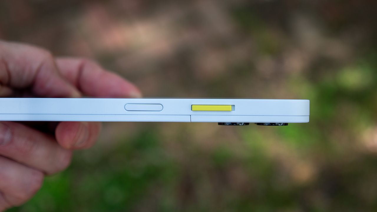 The right side of the Fairphone 6, which houses the combination power button/fingerprint sensor, and the customizable Fairphone switch