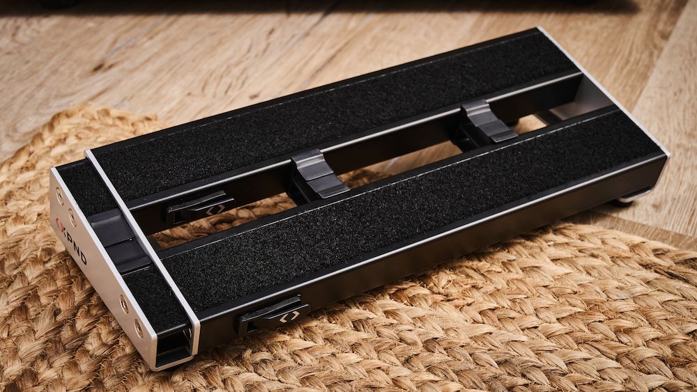 A D&rsquo;Addario XPND 1 pedalboard on a wooden floor