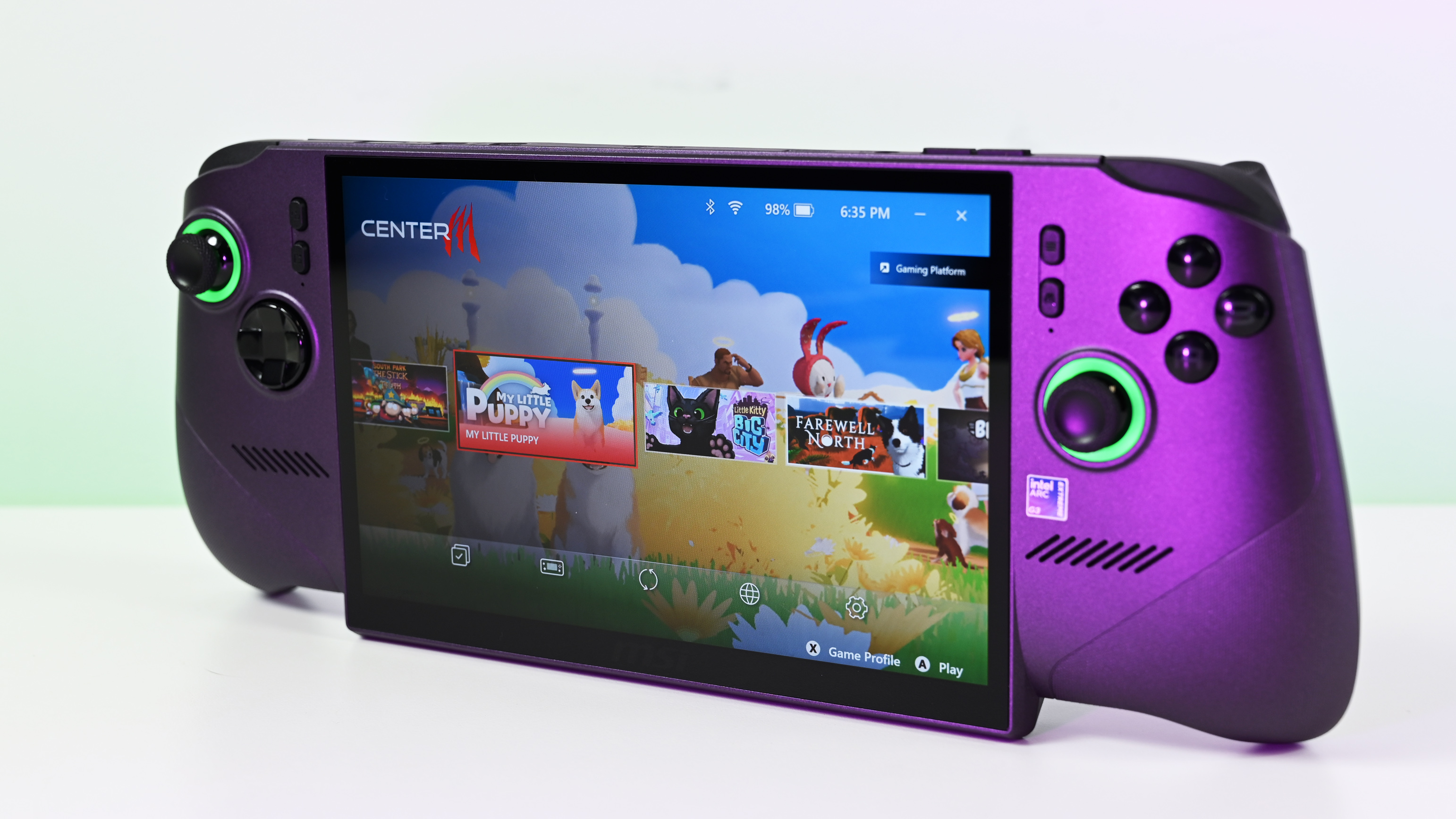 Three-quarter view of the purple MSI Claw 8 EX AI+ handheld gaming PC standing on a white surface, showing a game library carousel on the display.