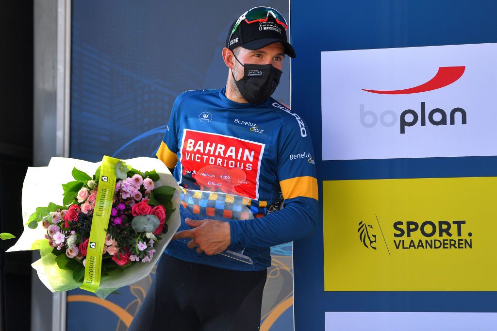 GERAARDSBERGEN BELGIUM SEPTEMBER 05 Sonny Colbrelli of Italy and Team Bahrain Victorious celebrates winning the blue leader jersey on the podium ceremony after the 17th Benelux Tour 2021 Stage 7 a 1809km stage from Namur to Geraardsbergen BeneluxTour on September 05 2021 in Geraardsbergen Belgium Photo by Luc ClaessenGetty Images