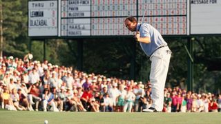 Tom Lehman putts at the 18th hole during the final round of the 1994 Masters