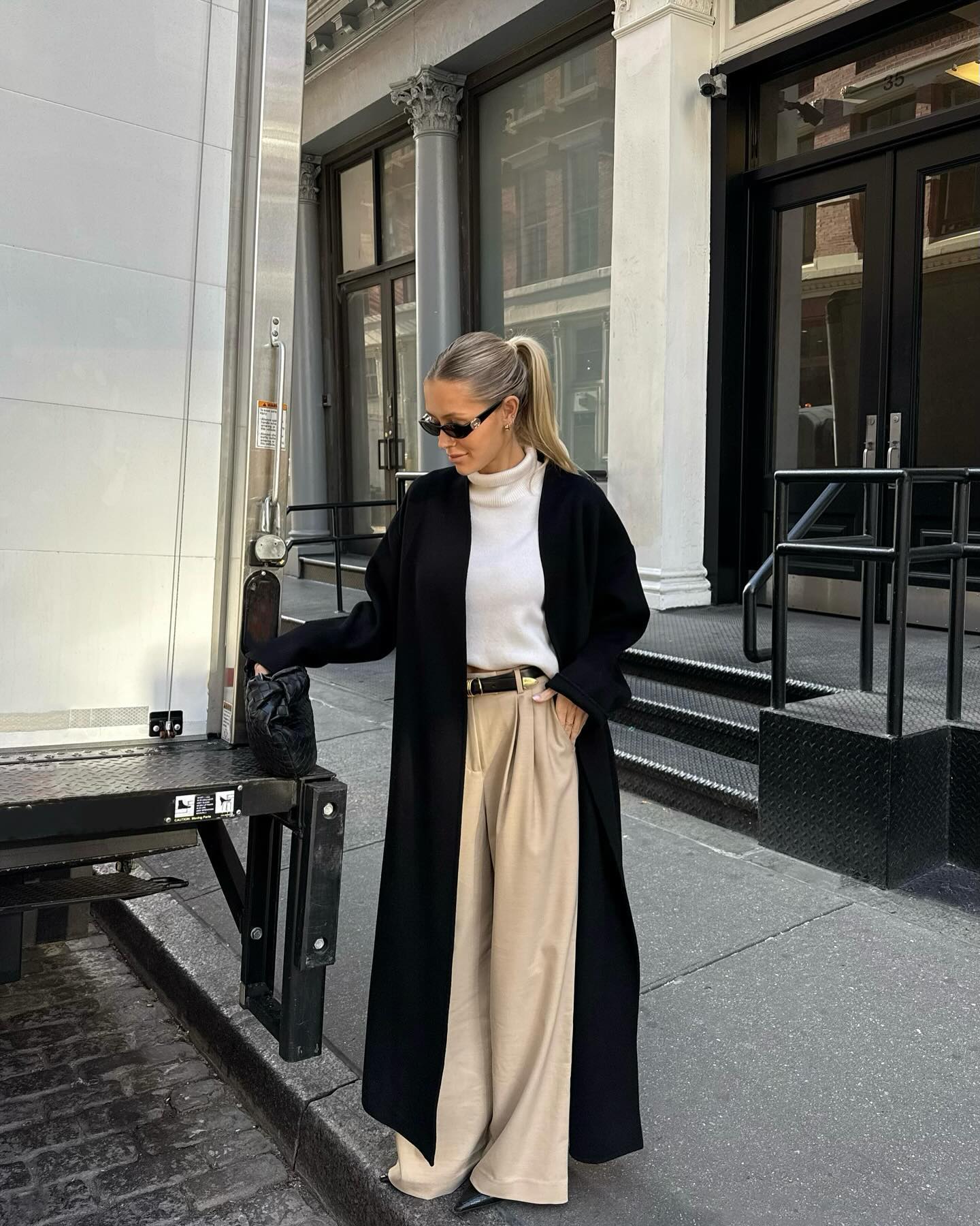 Fashion influencer @fredrika_ekerot wearing a chic long wool winter coat.