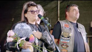 Dave's wife Lilli on stage thanking the fans with her husband's close friends Si King and Jason Wood by her side.