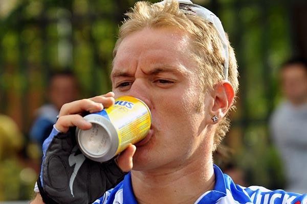 Belgian Wouter Weylandt (Quick Step) enjoys a refreshment after the day's stage.
