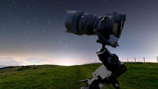 One of the best star trackers for astrophotography, the Star adventurer mini composited in front of a starry sky landscape