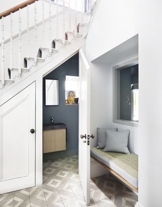 downstairs loo under stairs with white walls