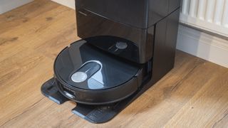 Roborock Qrevo Slim robot vacuum in its dock