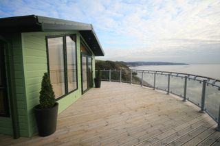 decking railing ideas: deck overlooking sea with Richard Burbidge fence